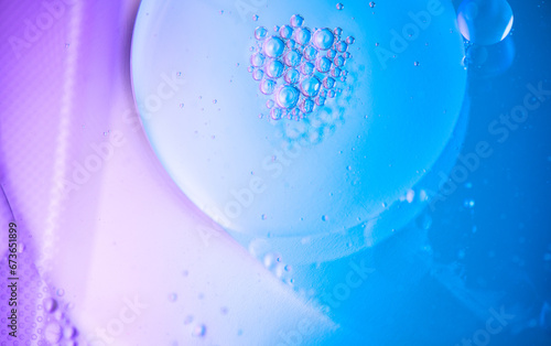 Abstract bubbles floating background. Liquid blue abstract backdrop. Flowing colorful abstract rounds texture. Beautiful blue and violet art design. Liquid. Wallpaper. Flowing Surface