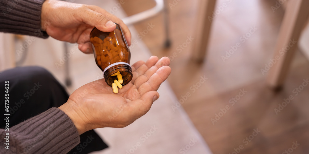 Medicine and healthcare of senior man taking daily pill for illness, medication and sick elderly with medical drugs, vitamin or supplements in his hand - obrazy, fototapety, plakaty 