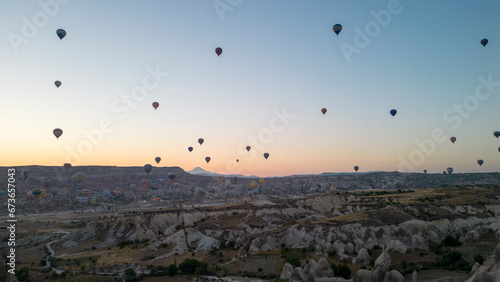 Hot air balloons. Hot air balloons flying over fairy chimneys in Cappadocia. Aerial view. Turkey tourist attractions