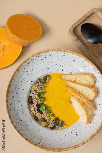 A plate of mashed pumpkin soup top view  flat lay. Autumn menu concept