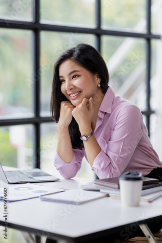 Business asian woman using calculator for do math finance in the office and business working background, tax, accounting, statistics and analytic research concept