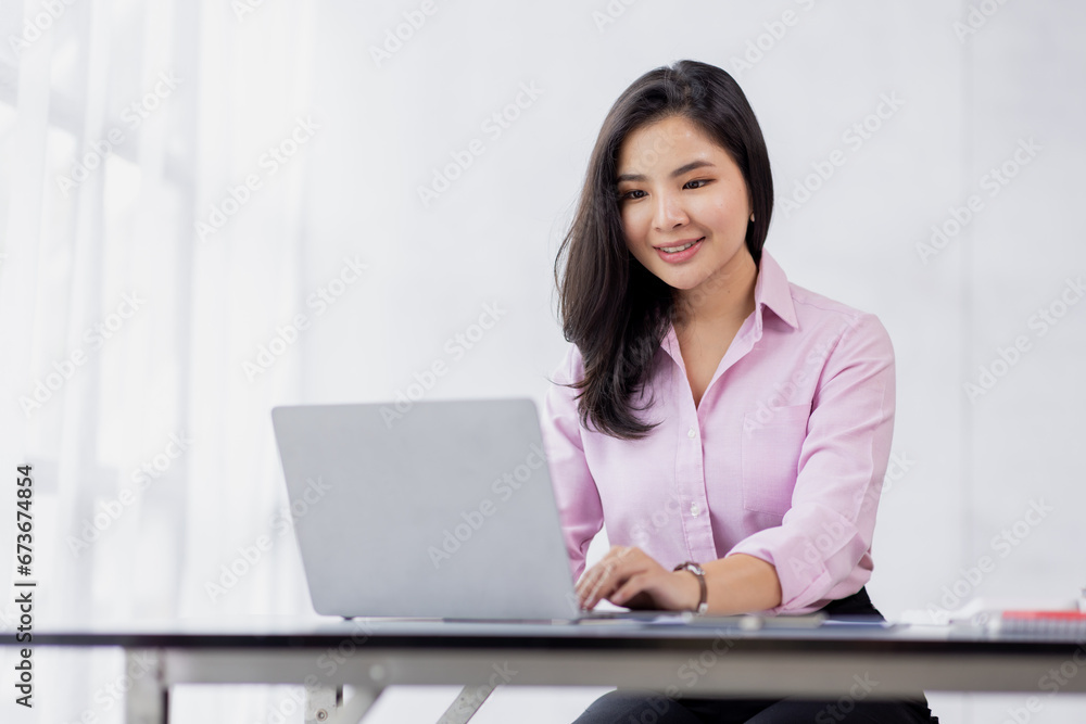 Business asian woman using calculator for do math finance in the office and business working background, tax, accounting, statistics and analytic research concept Business asian woman using calculator for do math finance in the office and business working background, tax, accounting, statistics and analytic research concept