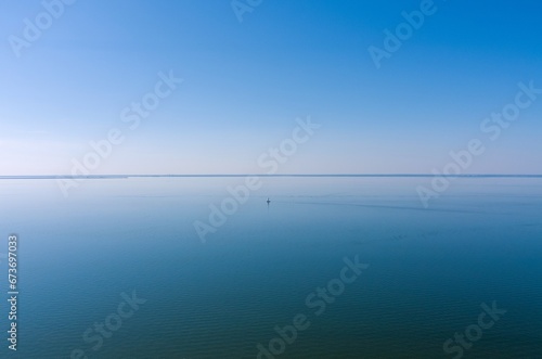 Aerial view of a sailboat in Mobile Bay