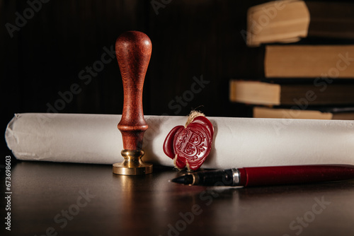 Notary's public pen and document with wax stamp on wooden table