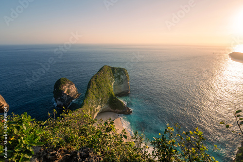 Aerial view of Kelingking Beach with the light of the sun shining at sunset On the island of Nusa Penida, Indonesia