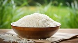 White rice in the bowl on rice farm background