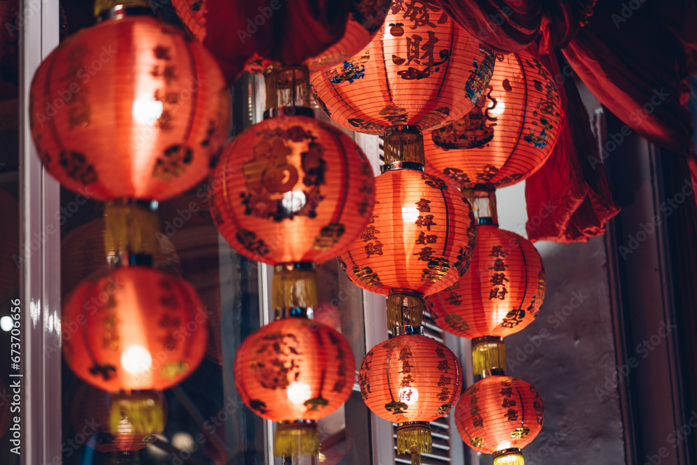 Red chinese lanterns illuminated at night. Chinese New Year Decorations. 