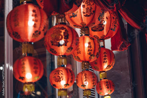 Red chinese lanterns illuminated at night. Chinese New Year Decorations. 