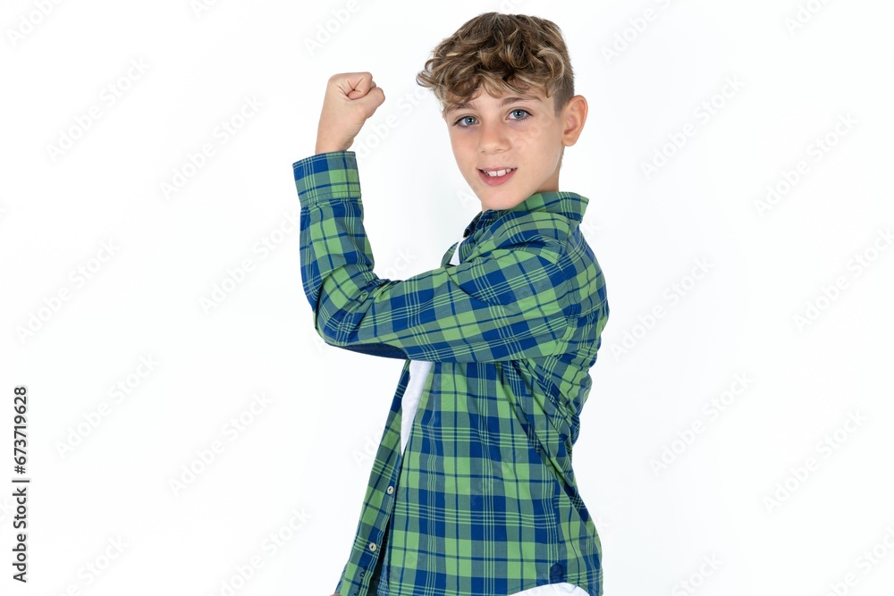 Portrait of powerful cheerful Caucasian teen boy showing muscles. Portrait of powerful cheerful Caucasian teen boy showing muscles.