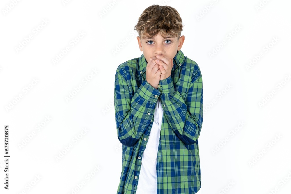 caucasian kid boy wearing plaid shirt holding oneself, feels very cold outside, hopes that will not get cold caucasian kid boy wearing plaid shirt holding oneself, feels very cold outside, hopes that will not get cold