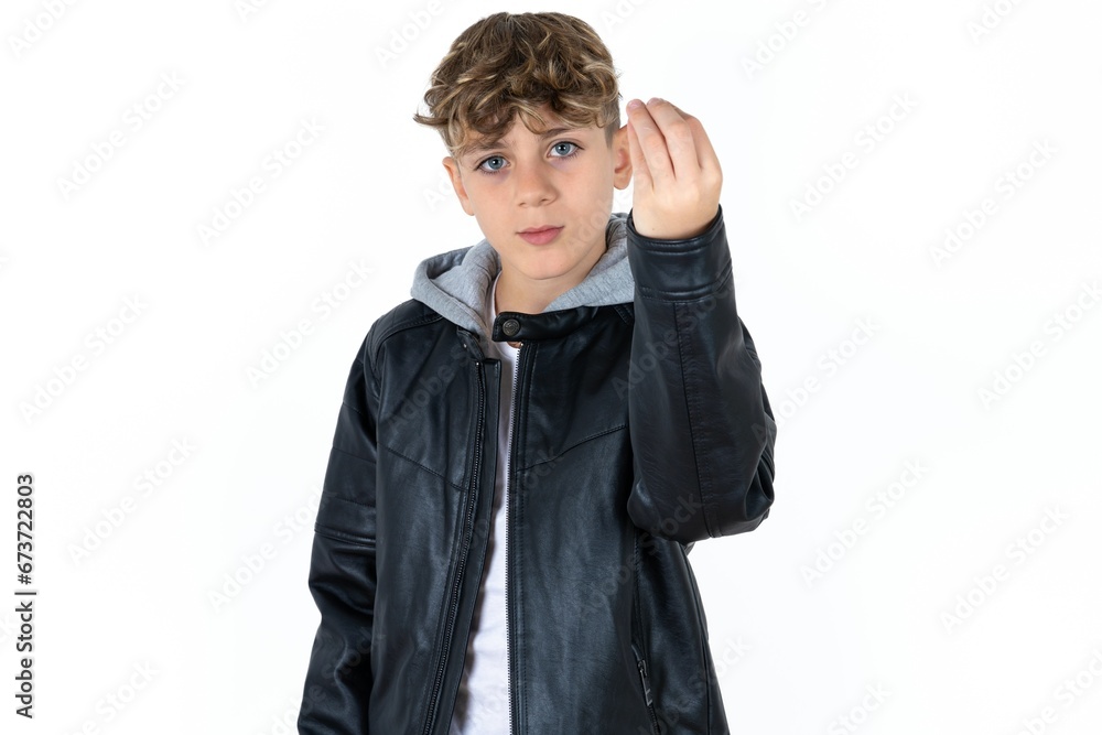 caucasian kid boy wearing black jacket Doing Italian gesture with hand and fingers confident expression caucasian kid boy wearing black jacket Doing Italian gesture with hand and fingers confident expression