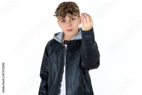  caucasian kid boy wearing black jacket Doing Italian gesture with hand and fingers confident expression