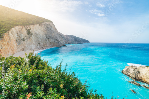 Beautiful beach and water bay in the greek spectacular coast line. Turquoise blue transparent water, unique rocky cliffs, Greece summer top travel destination Lefkada island