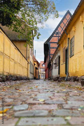 Odense, Denmark - October 21, 2023: Alley where the history museum of the city of Odense is located on the corner of Overgade 48. photo