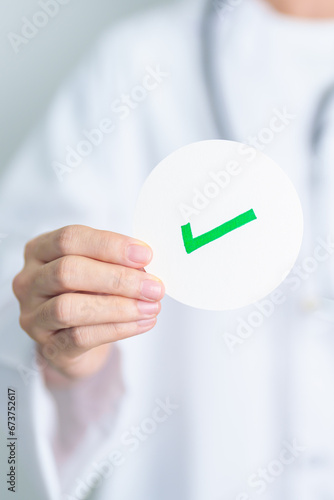 Doctor show Right symbol paper. True and false, accept and rejected, evaluation, Diagnosis, Vote, Poll, Yes or No, Health, Medical and Survey concepts