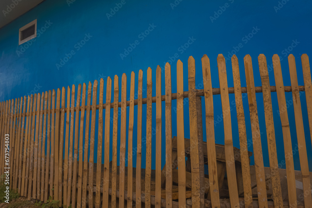 Traditional or ancient house fence made from dry golden bamboo 