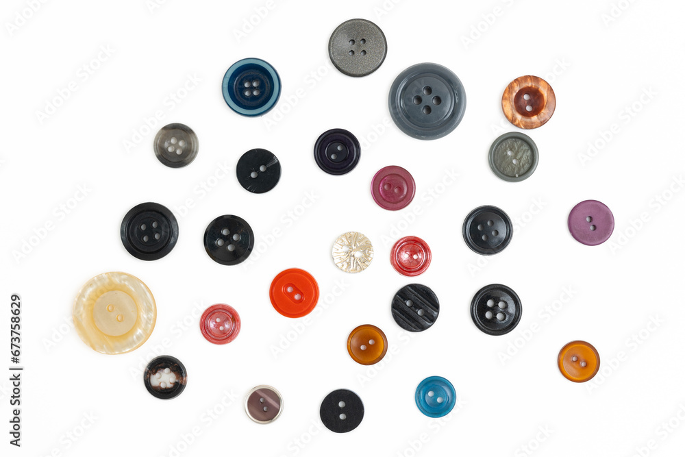Buttons of various sizes and colors on a white background