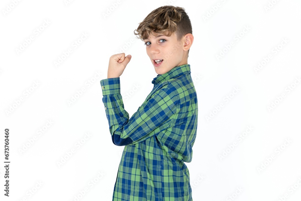 Profile side view portrait Caucasian teen boy wearing plaid shirt celebrates victory Profile side view portrait Caucasian teen boy wearing plaid shirt celebrates victory