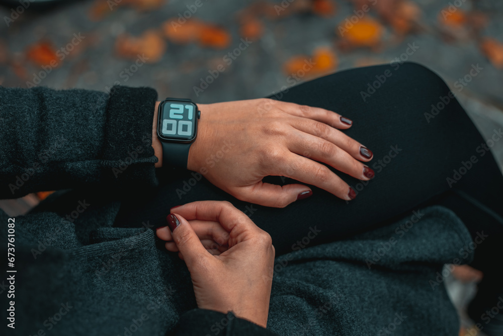 Smart watch. Smart watch on a woman hand outdoor. Woman hand touching a smart watch