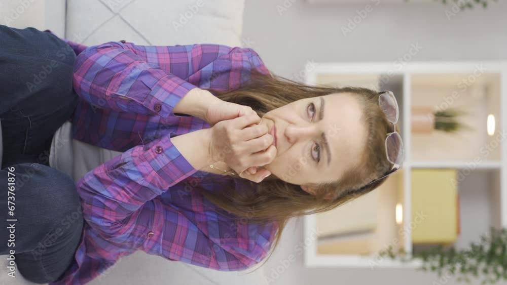 Vertical video of The grieving woman is thinking and suffering from depression. Vertical video of The grieving woman is thinking and suffering from depression.