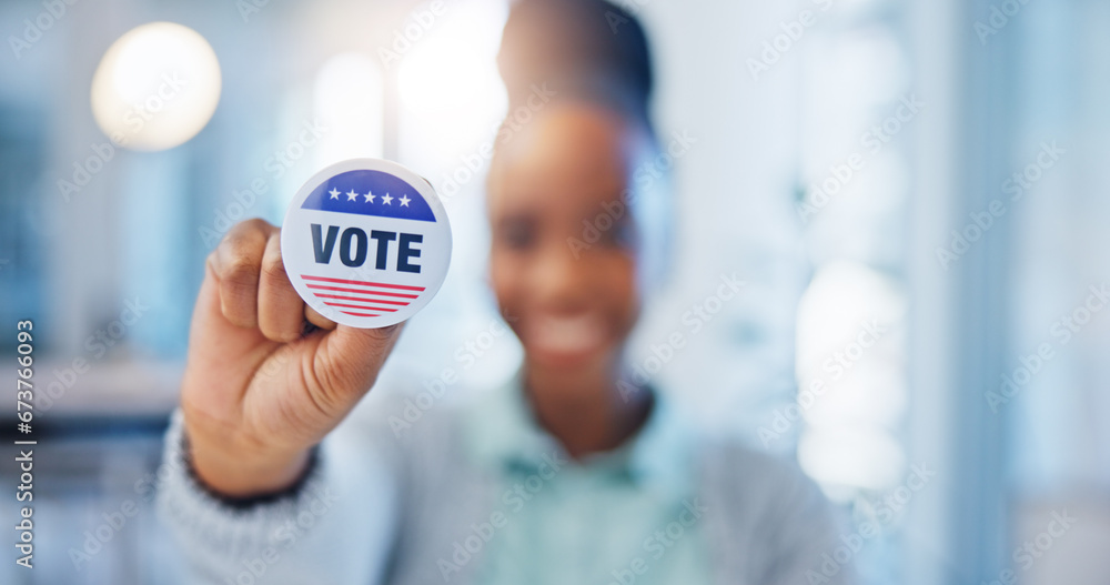 Hand, vote and badge with a black woman in government for support or motivation of a political campaign. Portrait, smile and democracy with a happy voter holding her pin of choice in a party election Hand, vote and badge with a black woman in government for support or motivation of a political campaign. Portrait, smile and democracy with a happy voter holding her pin of choice in a party election