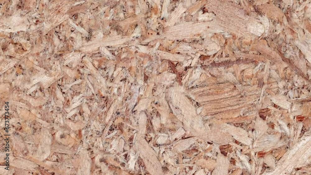 Chipboard plywood, surface, uniform texture background, glued wood chips rotating, turning, close-up macro, top view
Chipboard plywood, surface, uniform texture background, glued wood chips rotating, turning, close-up macro, top view