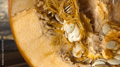 Inside  of  a  gian  orange  pumpkin  showing  seed and  pith photo