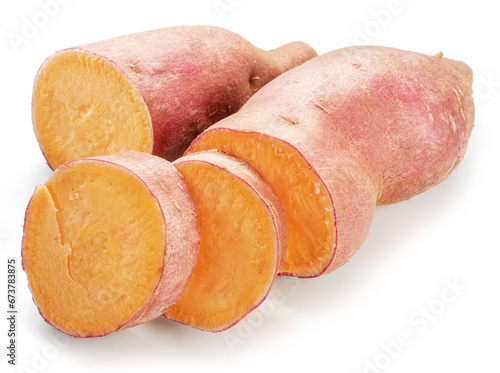 Ripe sweet potato tubers with sweet potato pieces isolated on white background.