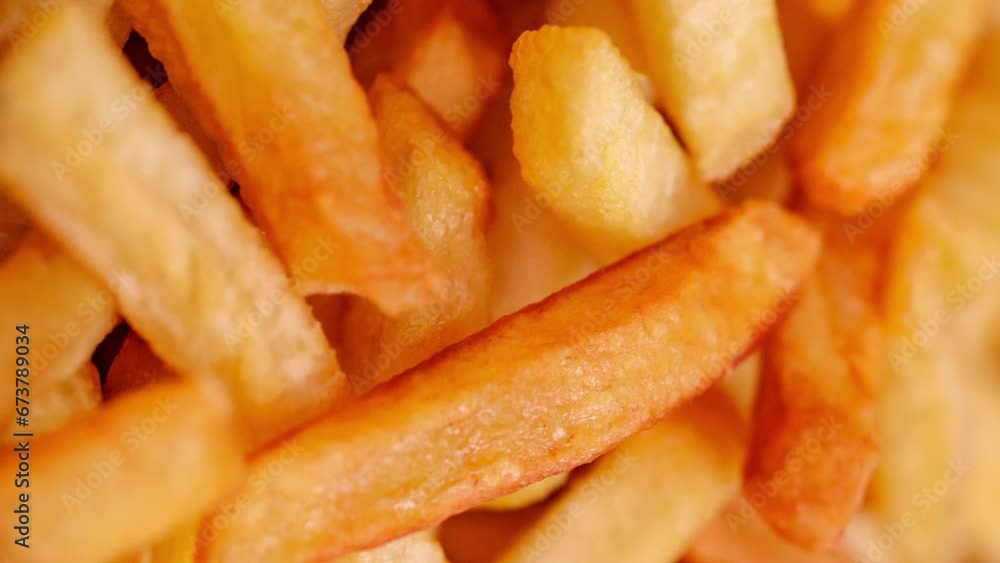 French fries potato, in bulk, rotating, turning, close-up macro, top view, selective focus
French fries potato, in bulk, rotating, turning, close-up macro, top view, selective focus