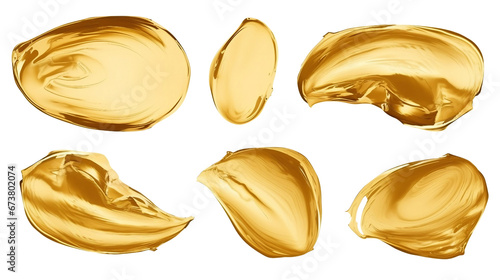 Creative brushstrokes of gold paint isolated on a white background. Gold paint texture.