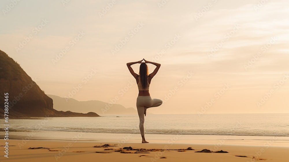 woman yoga pose on a beach