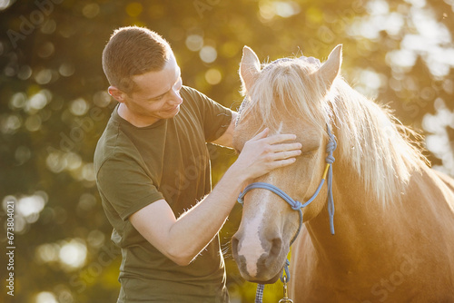 Canvas Print Man is embracing of therapy horse