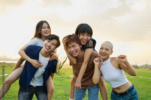 Image of a group of young Asian people laughing happily together © 1112000