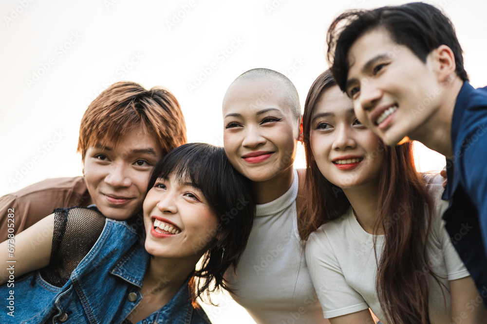 Image of a group of young Asian people laughing happily together Image of a group of young Asian people laughing happily together