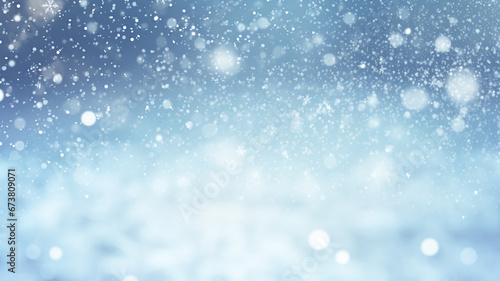 Winter snow background with snowdrifts, with beautiful light and snow flakes on the blue sky in the evening.   © BlazingDesigns