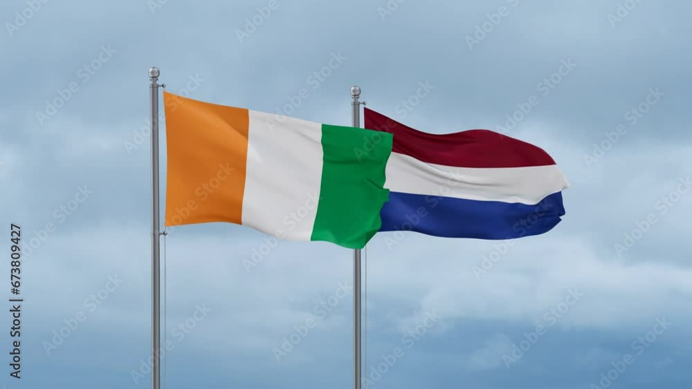 Netherlands flag and Ivory Coast, Cote d'Ivoire flag waving together on cloudy sky, endless seamless loop, two country relations concept Netherlands flag and Ivory Coast, Cote d'Ivoire flag waving together on cloudy sky, endless seamless loop, two country relations concept