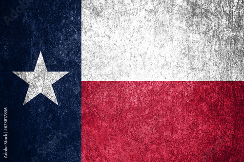 Close-up of the grunge Texas state flag. Dirty Texas state flag on a metal surface.