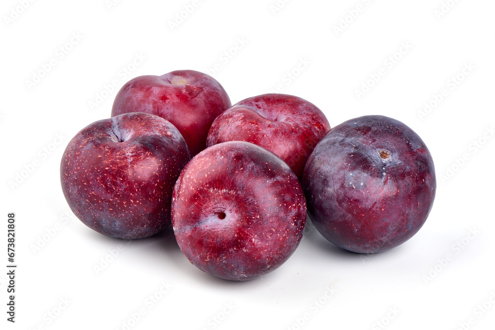 Sweet red plums, isolated on white background.