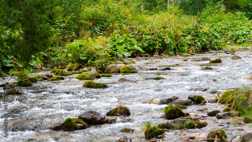 stream flowing view river mountainous area photo