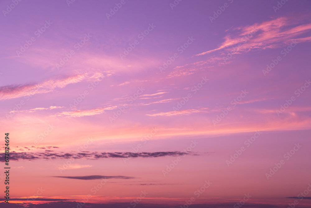 Pink purple violet beautiful sky. Beautiful soft gentle sunrise, sunset with cirrus clouds background texture