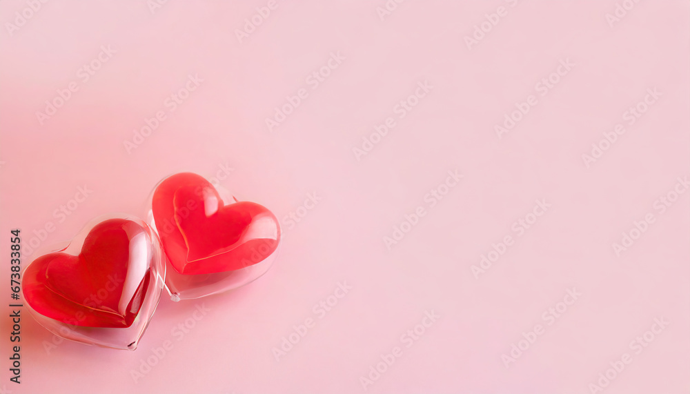 two red hearts on a pink background