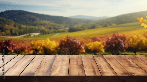 Wooden table in an autumn evening landscape with free space on the table for simulating product display. Winery and wine tasting concept