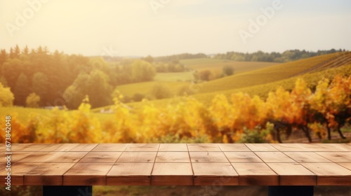 Wooden table in an autumn evening landscape with free space on the table for simulating product display. Winery and wine tasting concept