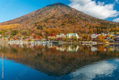 Idyllic landscape of lake Chuzenji and mountain Nantai in Nikko national park, Japan