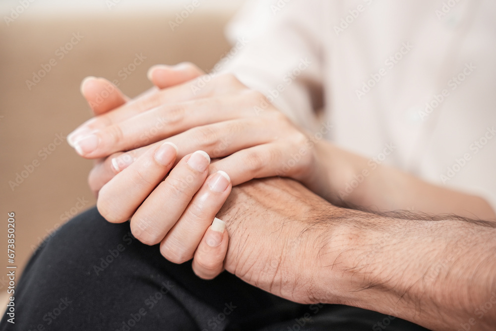 Close up of depression couple, patient consulting problem mental health with psychologist, psychiatrist at clinic together, husband encouraging by holding hand of wife, therapy health care. Close up of depression couple, patient consulting problem mental health with psychologist, psychiatrist at clinic together, husband encouraging by holding hand of wife, therapy health care.