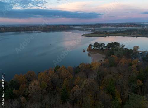 Colorful pink sunrise over a reservoir/lake in autumn, located in Kaunas, Lithuania