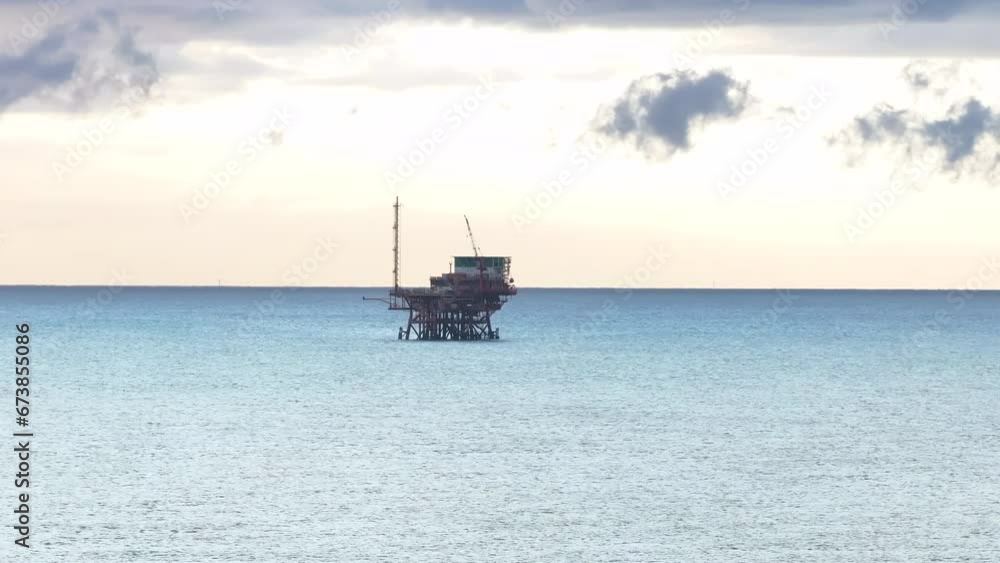 Drilling rig for gas extraction in the Adriatic Sea at sunrise Drilling rig for gas extraction in the Adriatic Sea at sunrise