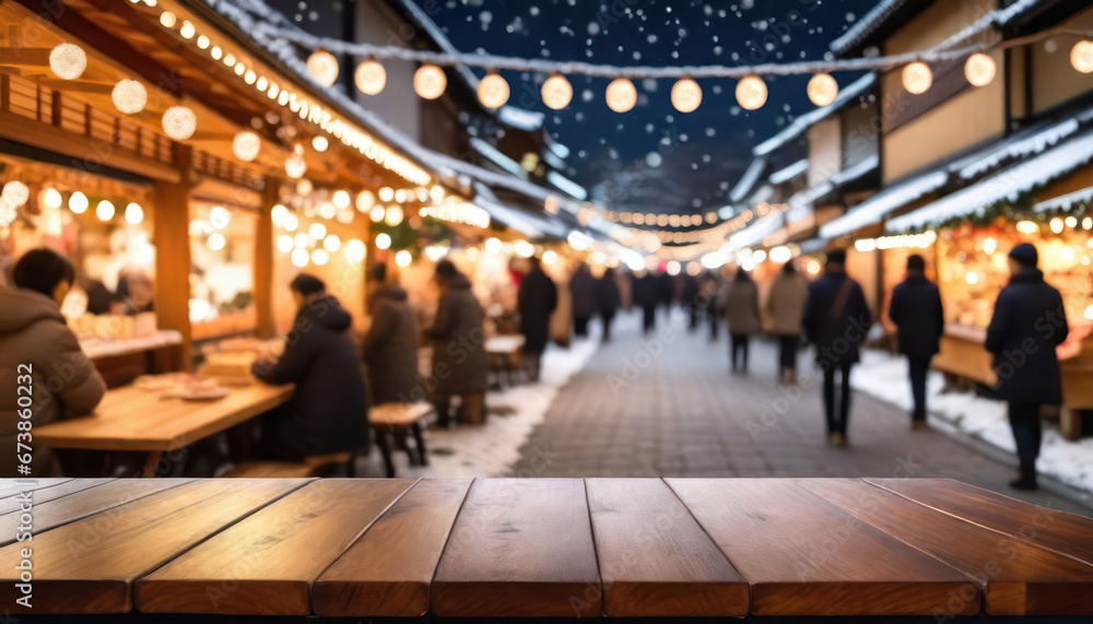 Empty table with blurred christmas or winter market in the background with copy space