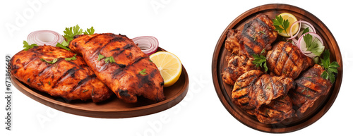 Tandoori style grilled chicken collection on wooden plates isolated on white background