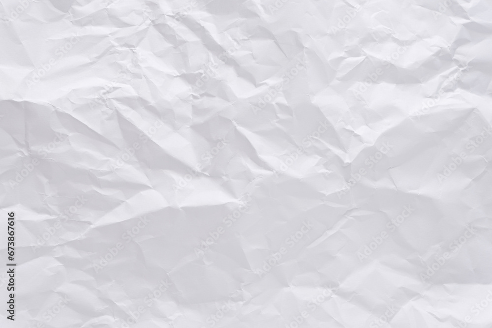 White crumpled paper texture background, clean white wrinkled paper, top view.